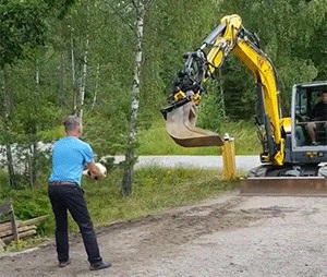 Playing ball with excavator